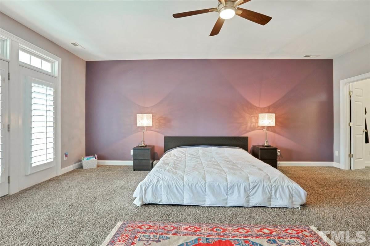 12317 Beestone Lane Raleigh, NC 27614 - Photo 16 of 30 a bedroom with a bed and window