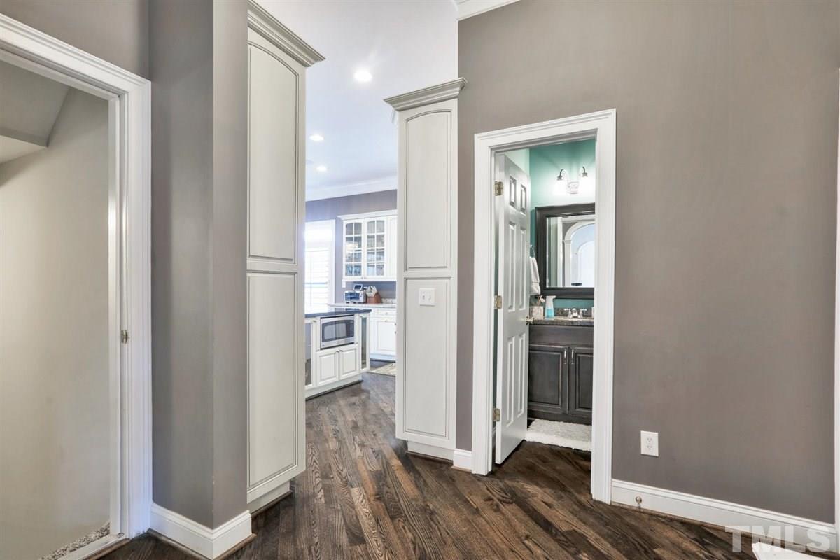 12317 Beestone Lane Raleigh, NC 27614 - Photo 17 of 30 a view of walk in closet with wooden floor