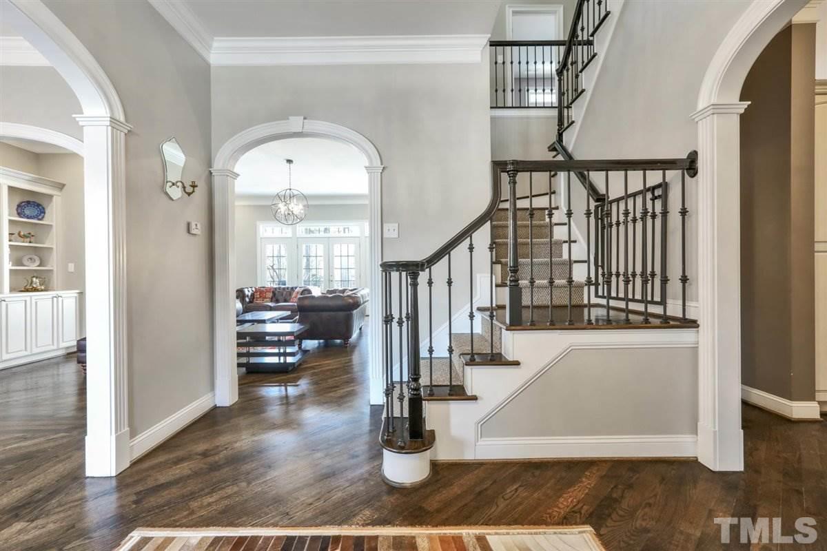 12317 Beestone Lane Raleigh, NC 27614 - Photo 3 of 30 a view of entryway and hall with wooden floor