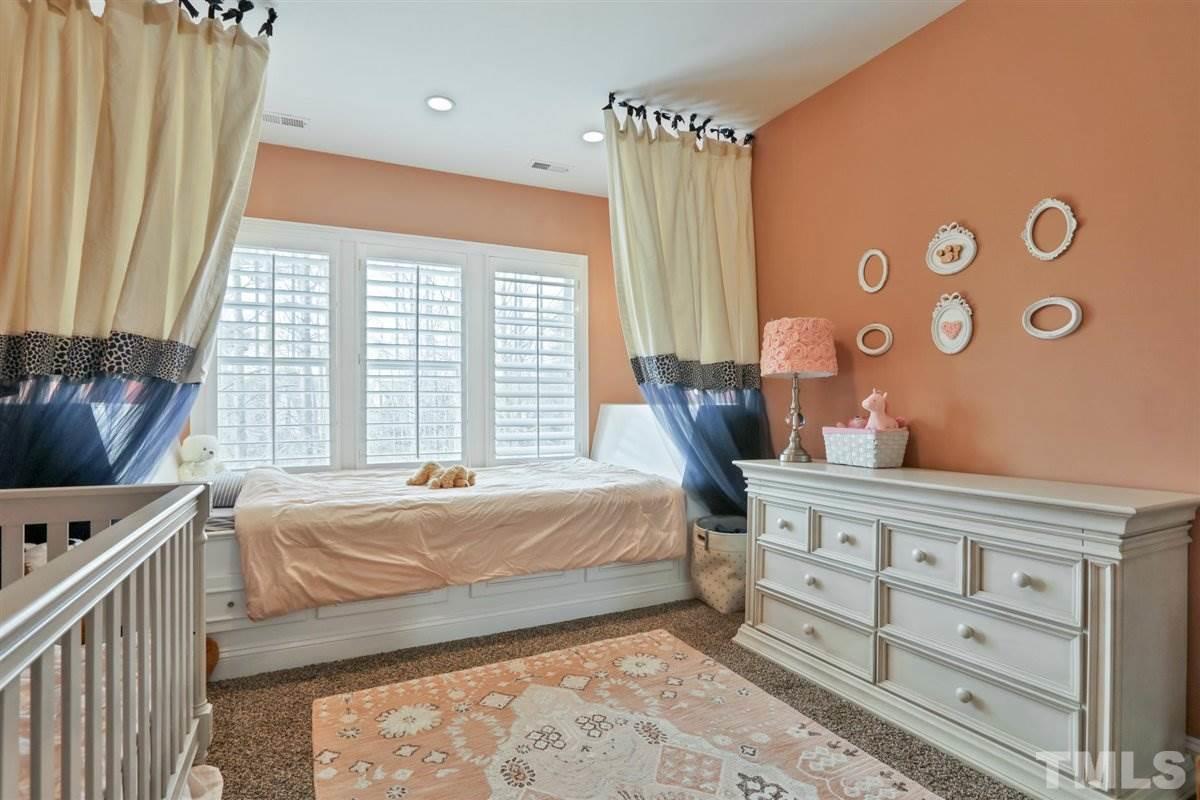 12317 Beestone Lane Raleigh, NC 27614 - Photo 23 of 30 a bedroom with a bed and a window