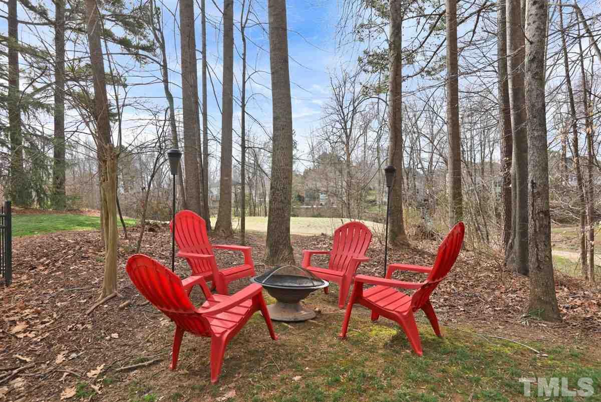 12317 Beestone Lane Raleigh, NC 27614 - Photo 28 of 30 a view of a chairs in backyard of house
