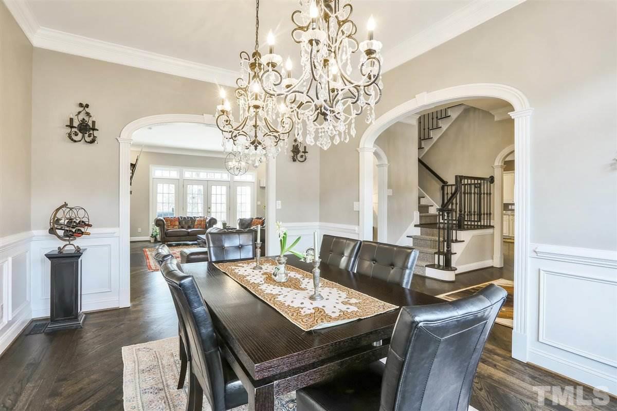 12317 Beestone Lane Raleigh, NC 27614 - Photo 4 of 30 a view of a dining room with furniture window and wooden floor