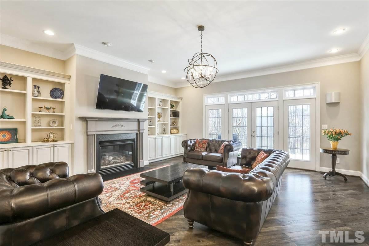 12317 Beestone Lane Raleigh, NC 27614 - Photo 5 of 30 a living room with furniture fireplace and flat screen tv