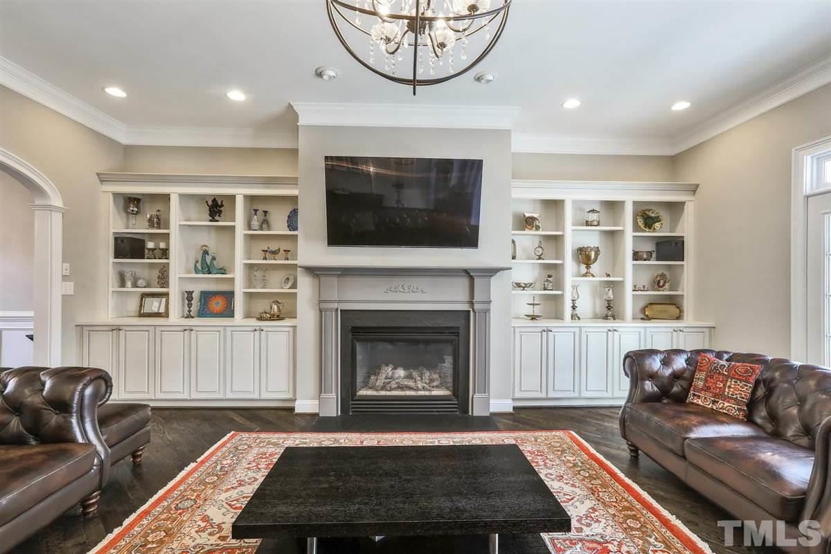 12317 Beestone Lane Raleigh, NC 27614 - Photo 6 of 30 a living room with furniture a window and a fireplace