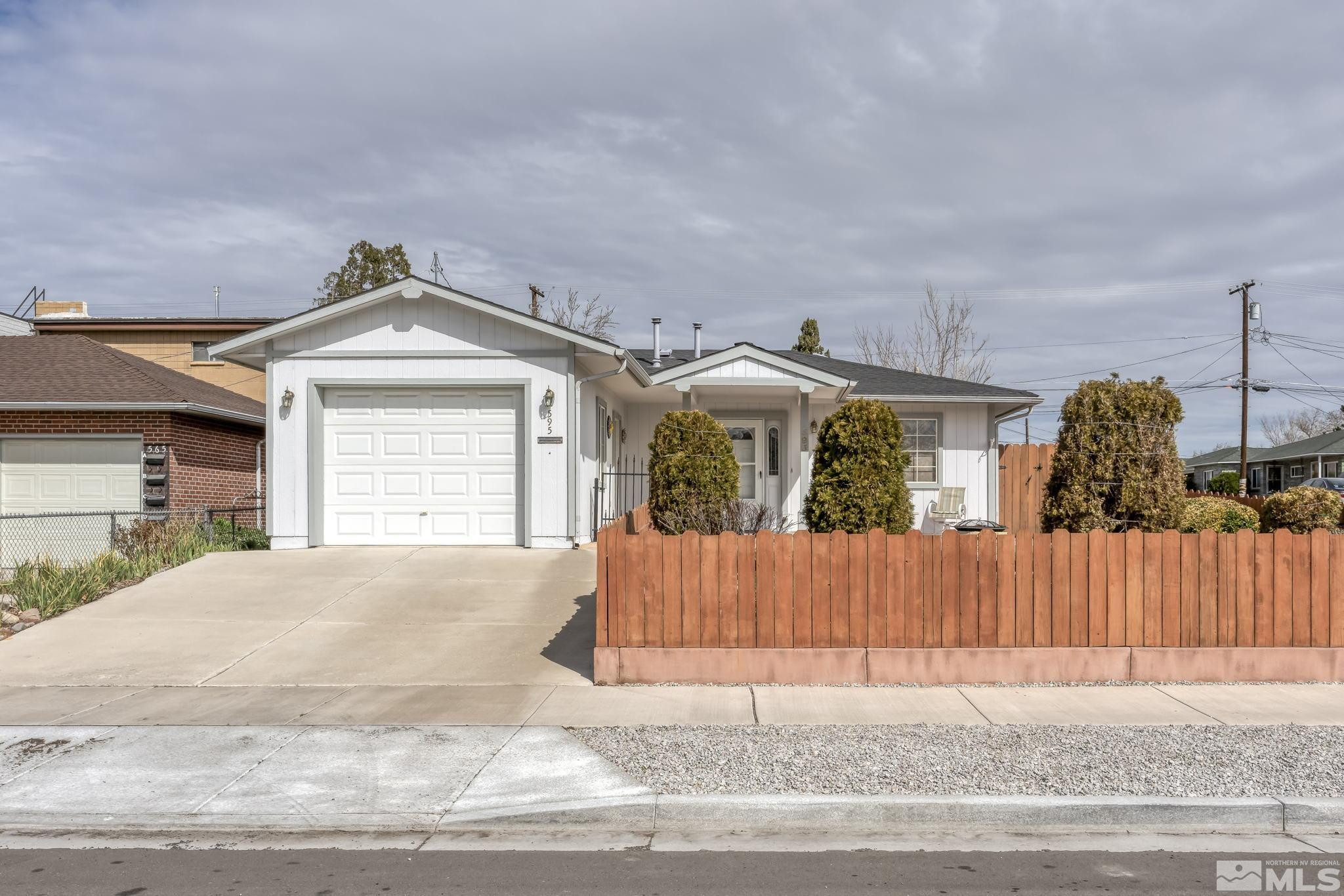 595 Roberts Street Reno, NV 89502 - Photo 1 of 24 a view of a house with a wooden fence