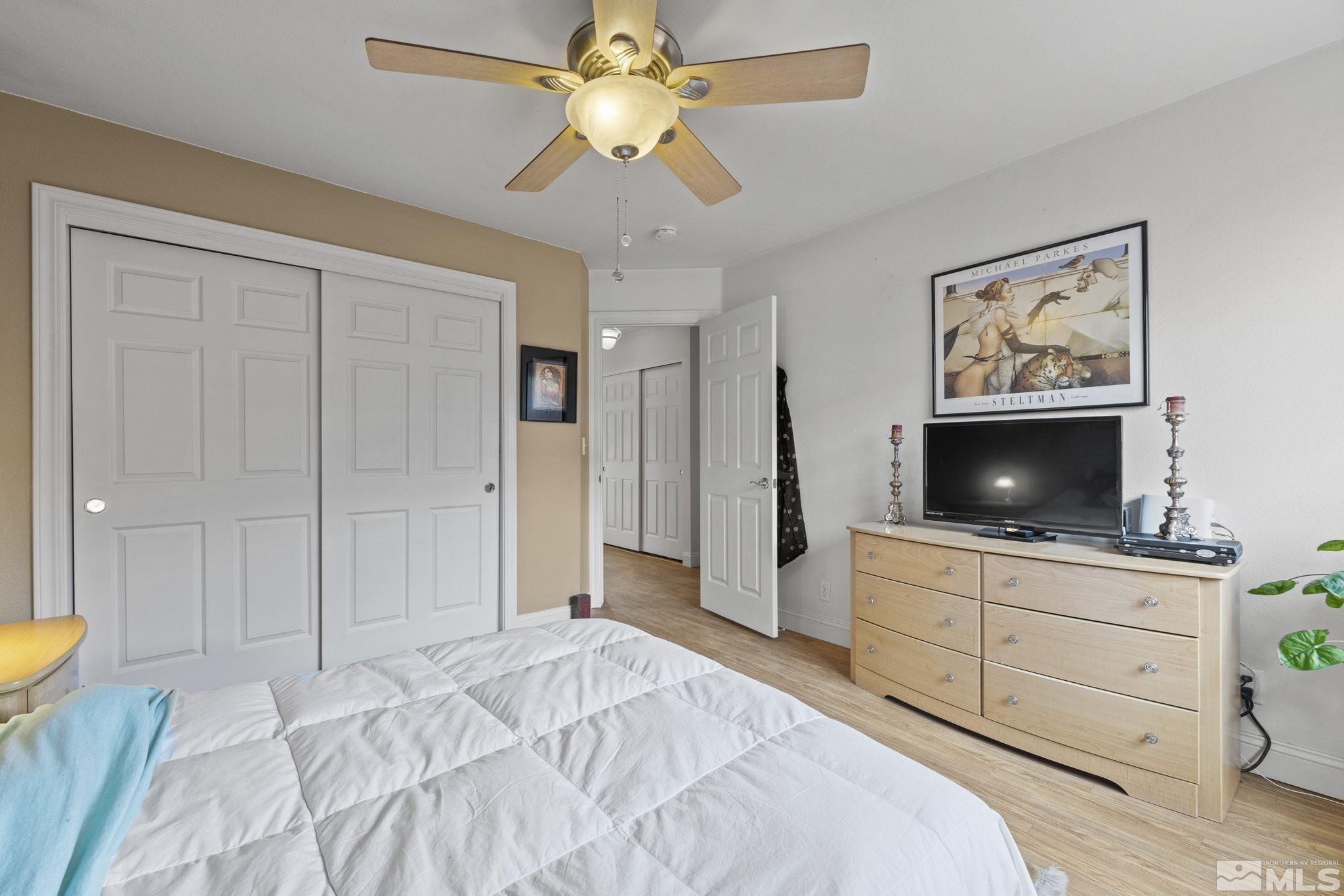 595 Roberts Street Reno, NV 89502 - Photo 16 of 24 a bedroom with a bed and a flat screen tv