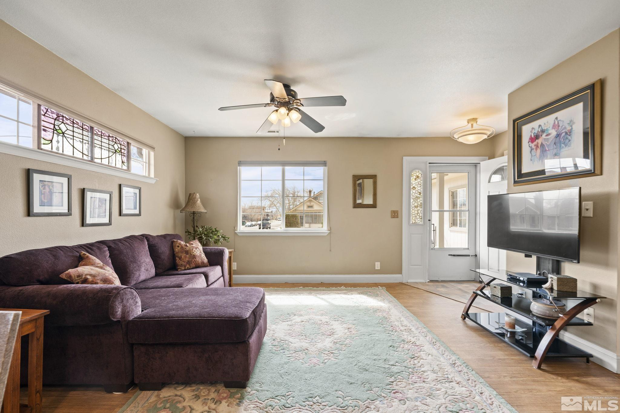 595 Roberts Street Reno, NV 89502 - Photo 8 of 24 a living room with furniture a ceiling fan and a window