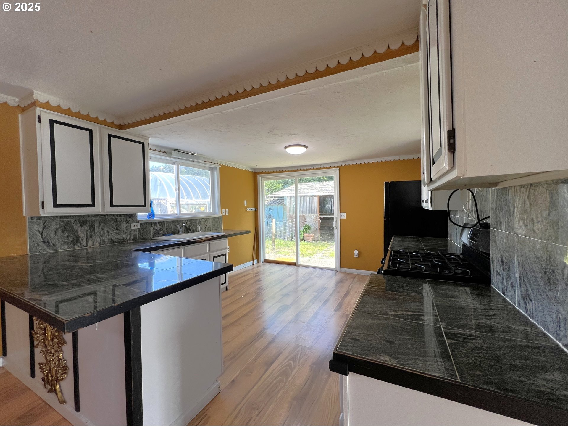 1042 Fir Avenue Reedsport, OR 97467 - Photo 13 of 47 a kitchen with sink and cabinets