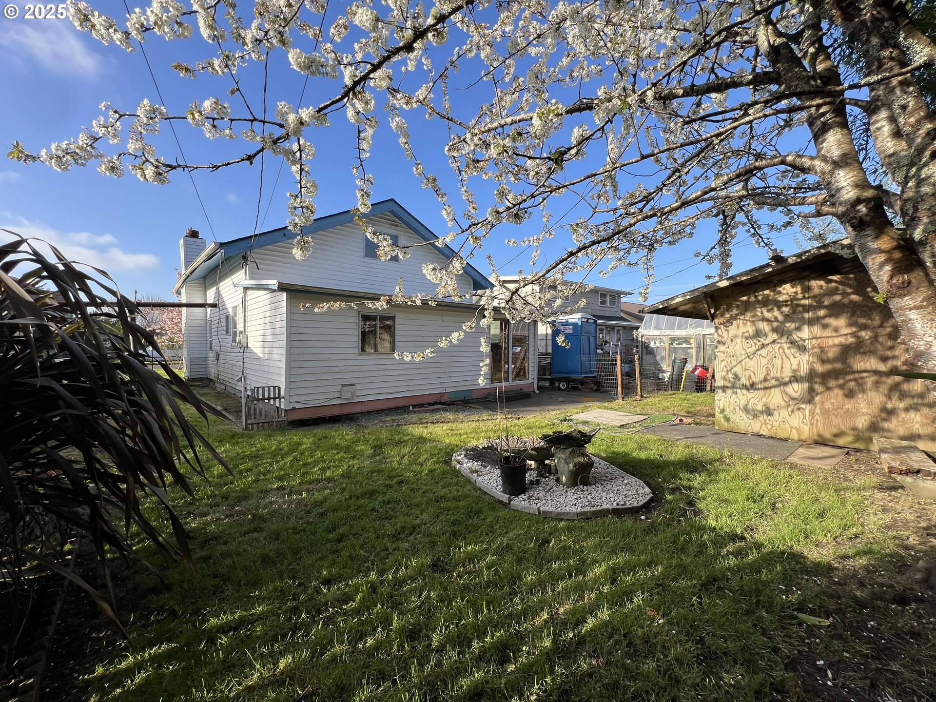 1042 Fir Avenue Reedsport, OR 97467 - Photo 42 of 47 a backyard of a house with a large tree and yard