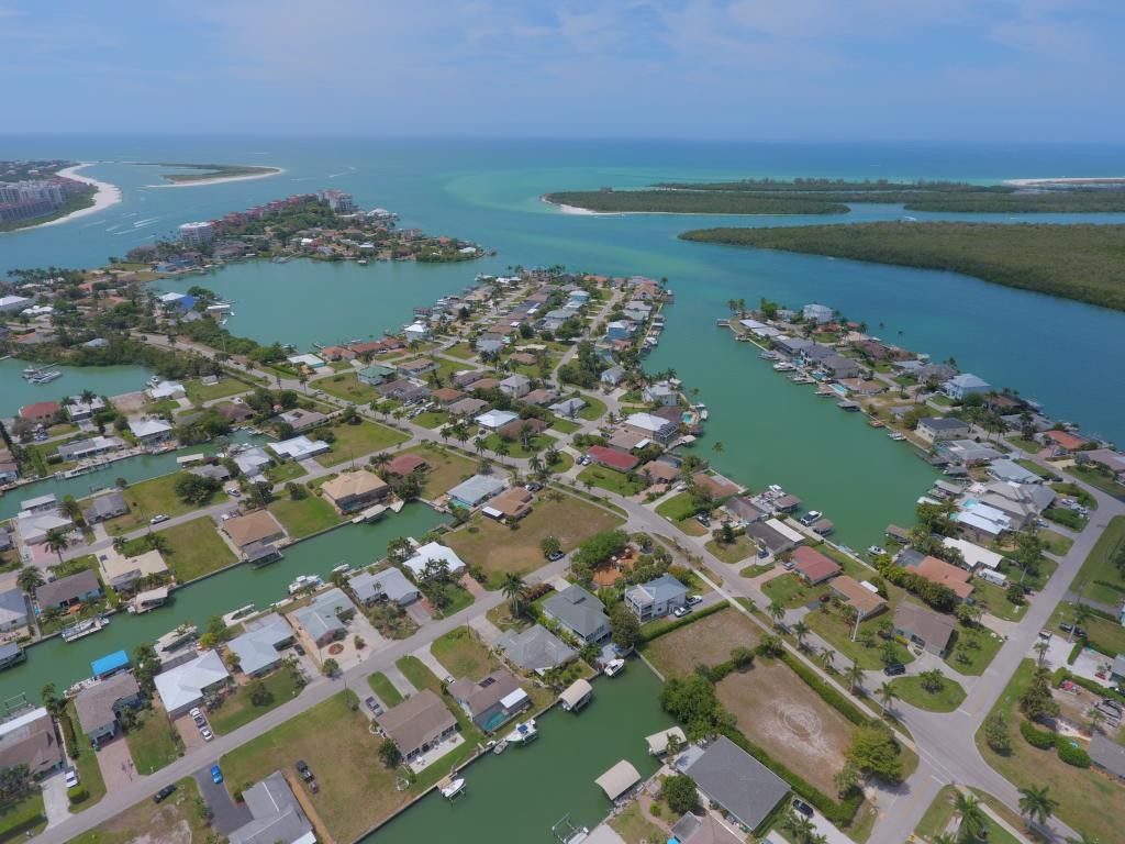 147 Capri Naples Naples, FL 34113 - Photo 5 of 19 an aerial view of a city with ocean view