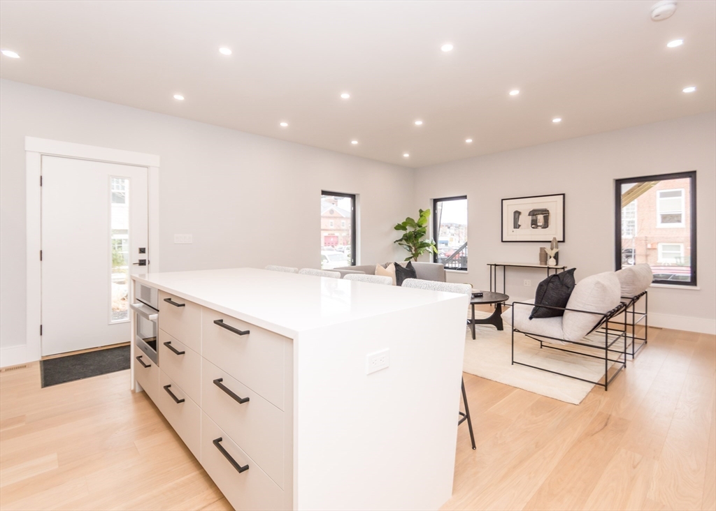 15 Alder Street, Unit 1 Waltham, MA 02453 - Photo 11 of 38 a living room with furniture and a table
