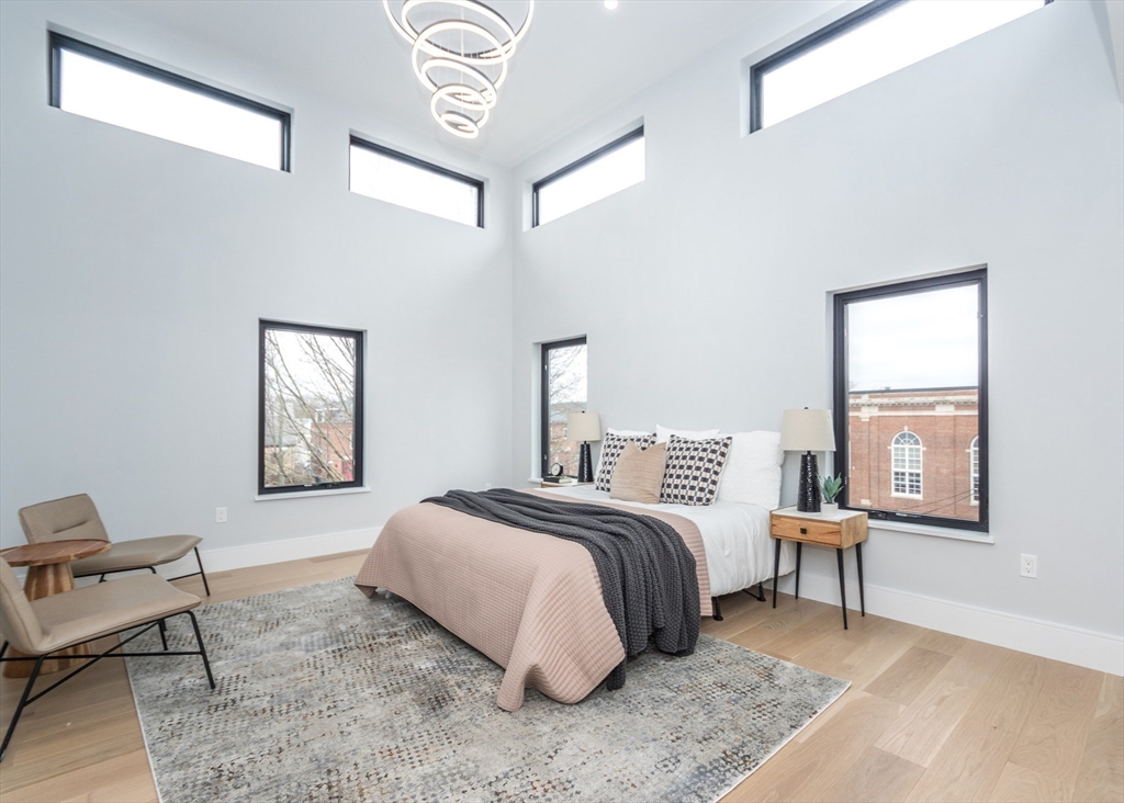 15 Alder Street, Unit 1 Waltham, MA 02453 - Photo 12 of 38 a bedroom with a bed and a window