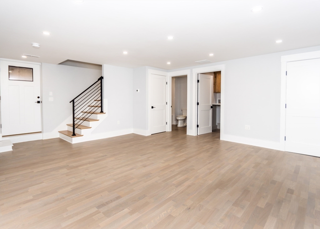 15 Alder Street, Unit 1 Waltham, MA 02453 - Photo 22 of 38 a view of entryway and hall with wooden floor