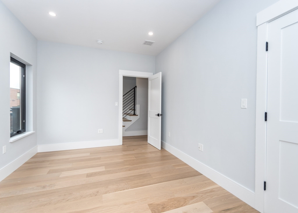 15 Alder Street, Unit 1 Waltham, MA 02453 - Photo 27 of 38 a view of an empty room