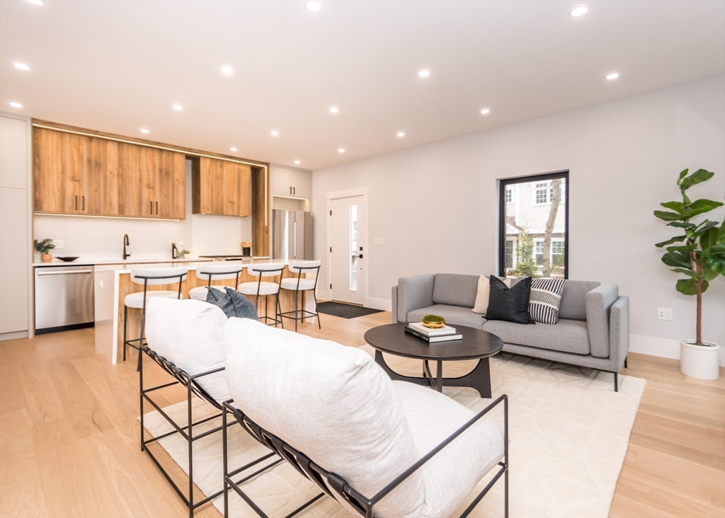 15 Alder Street, Unit 1 Waltham, MA 02453 - Photo 8 of 38 a living room with furniture and kitchen view