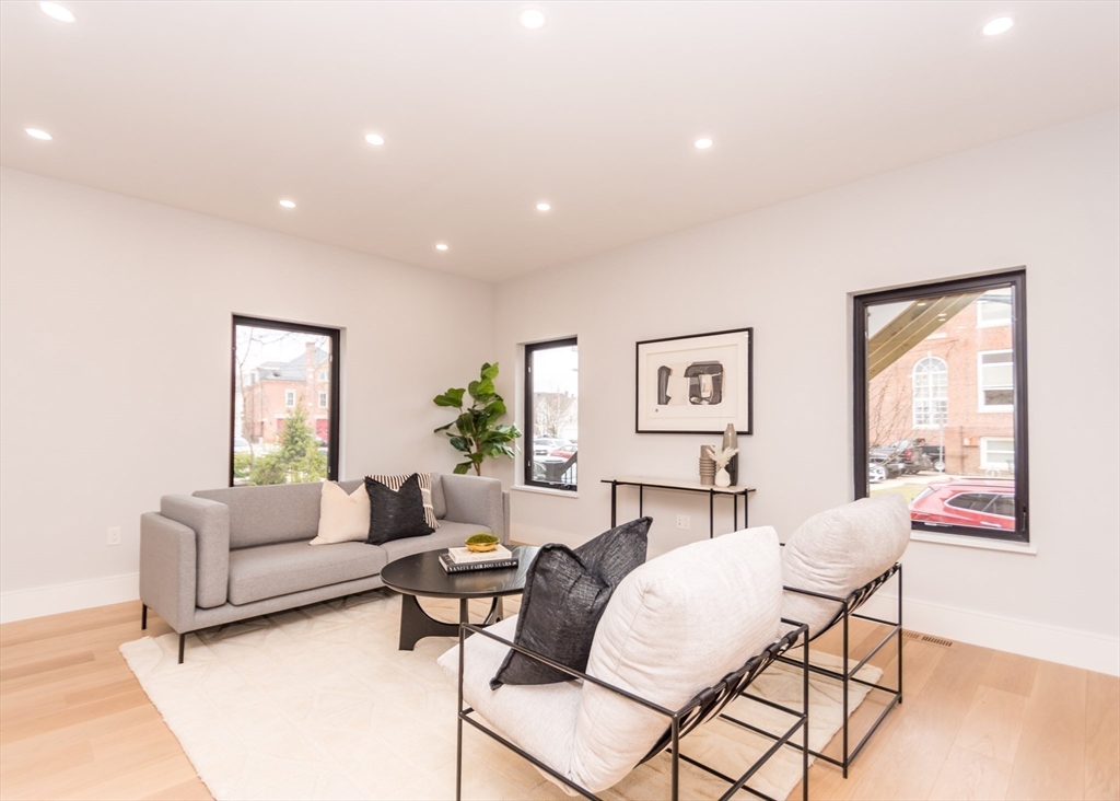 15 Alder Street, Unit 1 Waltham, MA 02453 - Photo 9 of 38 a living room with furniture and a window