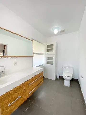 a bathroom with a sink and mirror