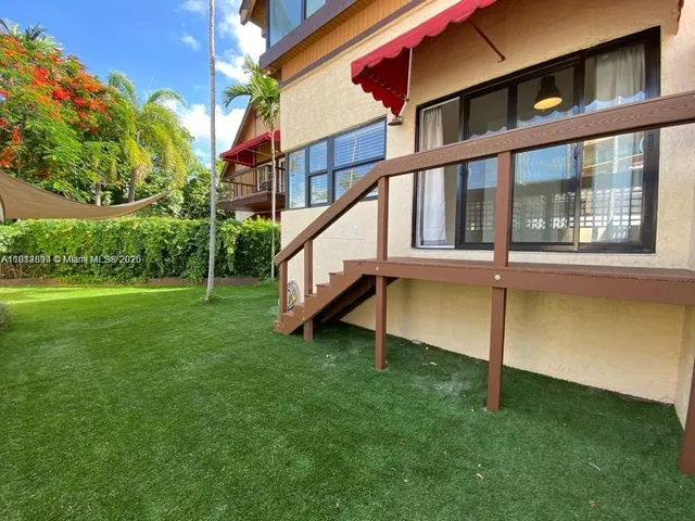 a house view with a garden space