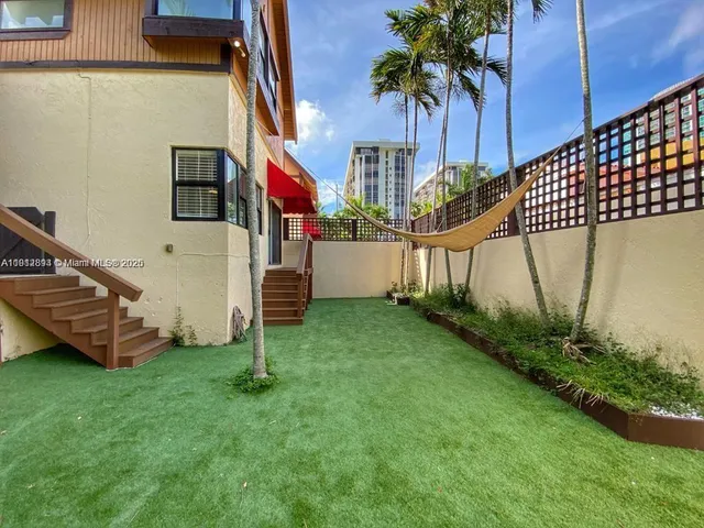 a house view with a garden space