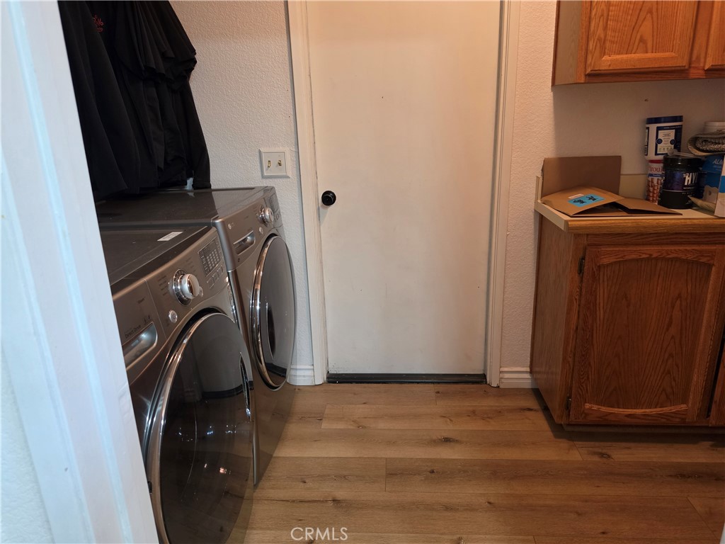 13502 Cuyamaca Road Apple Valley, CA 92308 - Photo 13 of 15 a view of walk in closet with clothes and shoes