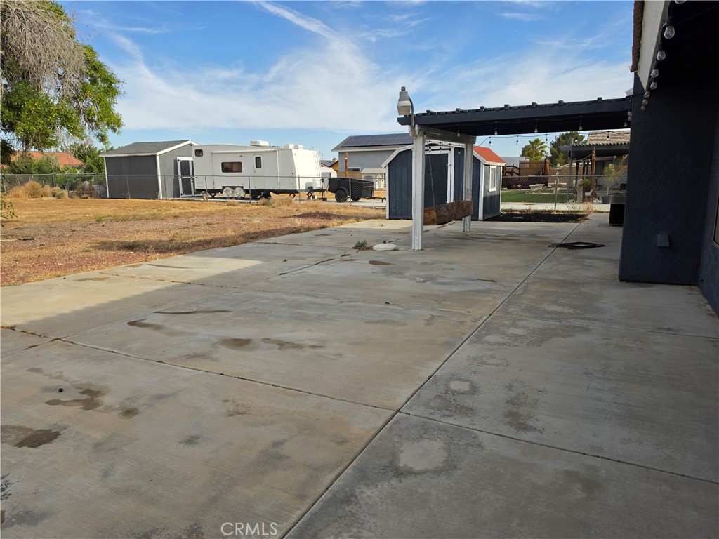 13502 Cuyamaca Road Apple Valley, CA 92308 - Photo 9 of 15 a front view of a house with a yard