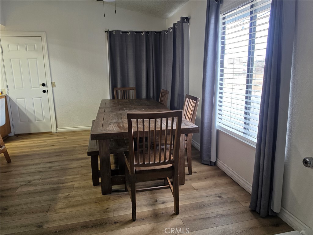 13502 Cuyamaca Road Apple Valley, CA 92308 - Photo 10 of 15 a view of a room with furniture window and wooden floor