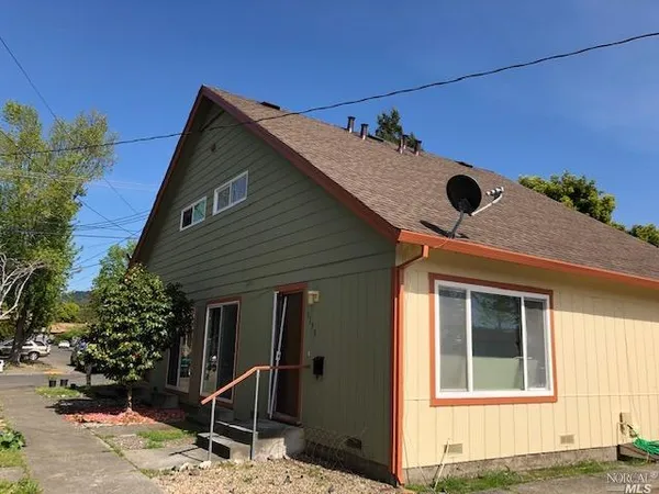 a backyard of a house with seating space