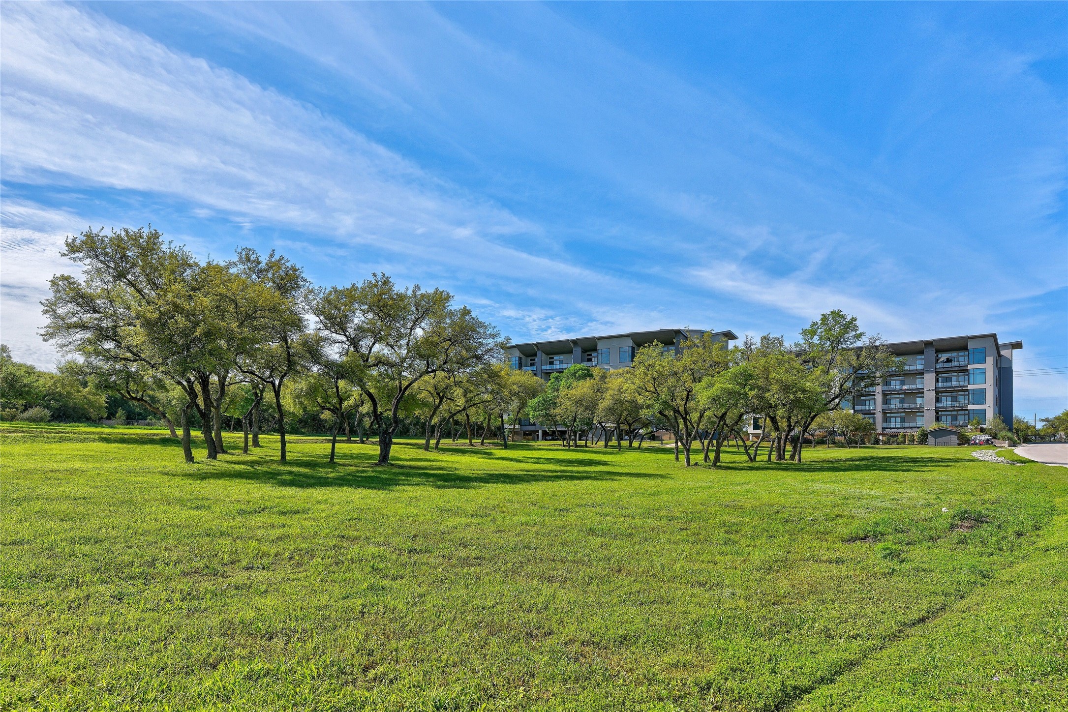 5921 Hiline Road, Unit 2403 Austin, TX 78734 - Photo 25 of 35 View of your backyard from the shoreline serving as the community's 14-acres HOA park.
