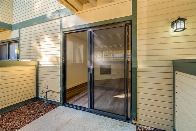 a view of a door and a window