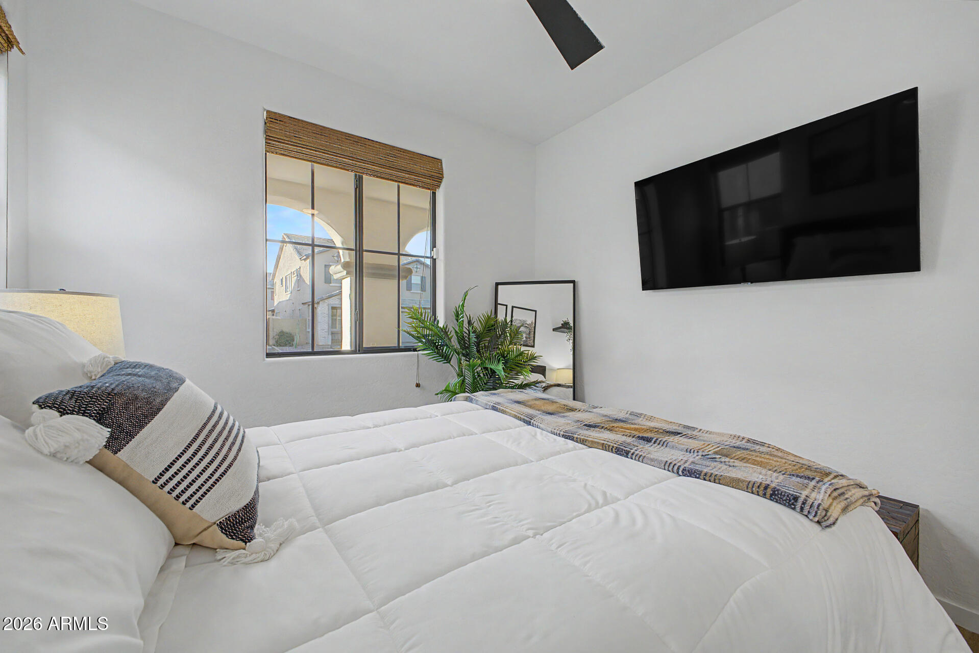 819 West Deer Creek Road Phoenix, AZ 85048 - Photo 42 of 76 a bedroom with a bed and a television