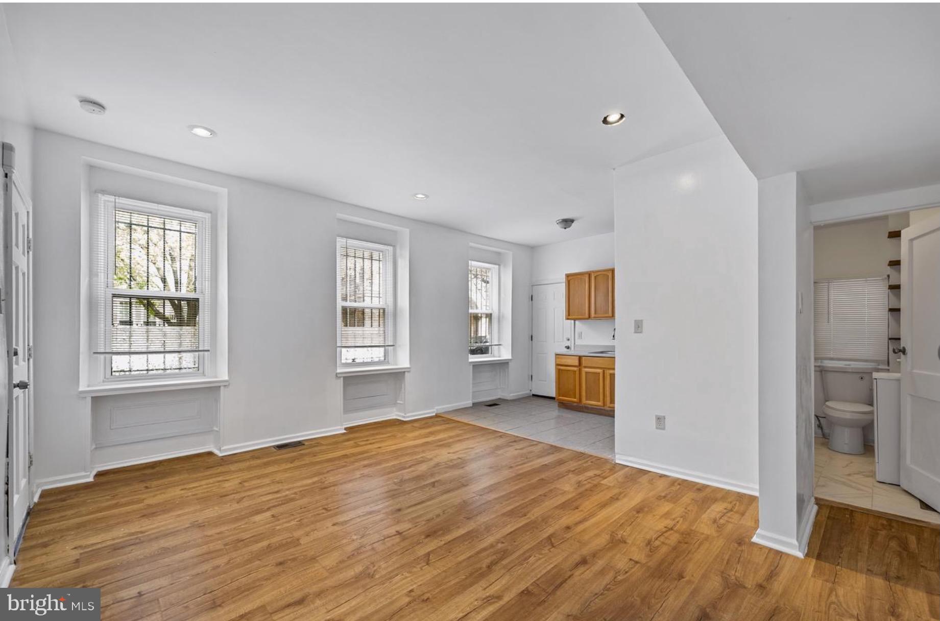 3800 Spring Garden Street, Unit 1 Philadelphia, PA 19104 - Photo 4 of 10 a view of a livingroom with wooden floor and a window