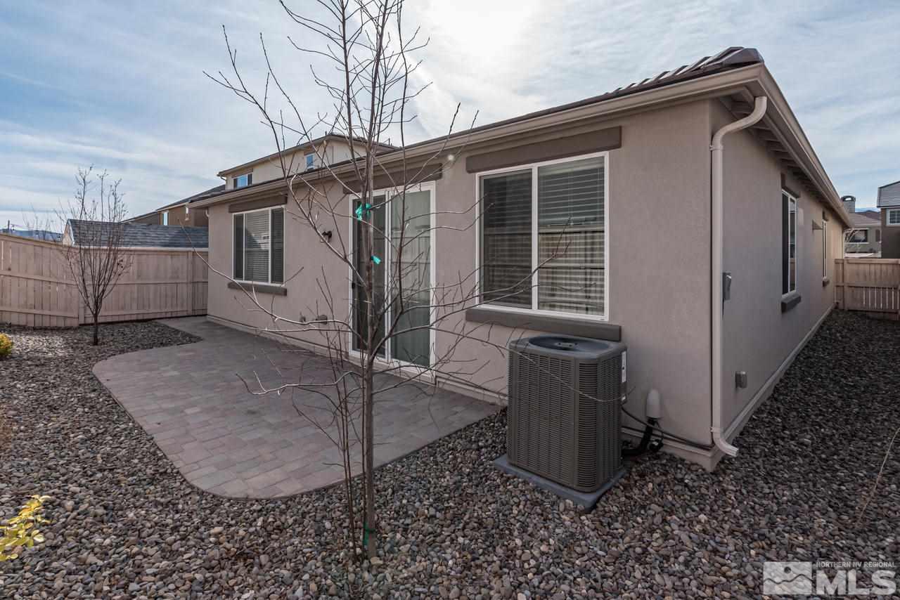 9728 Pachuca Drive Reno, NV 89521 - Photo 24 of 25 a view of a house with backyard