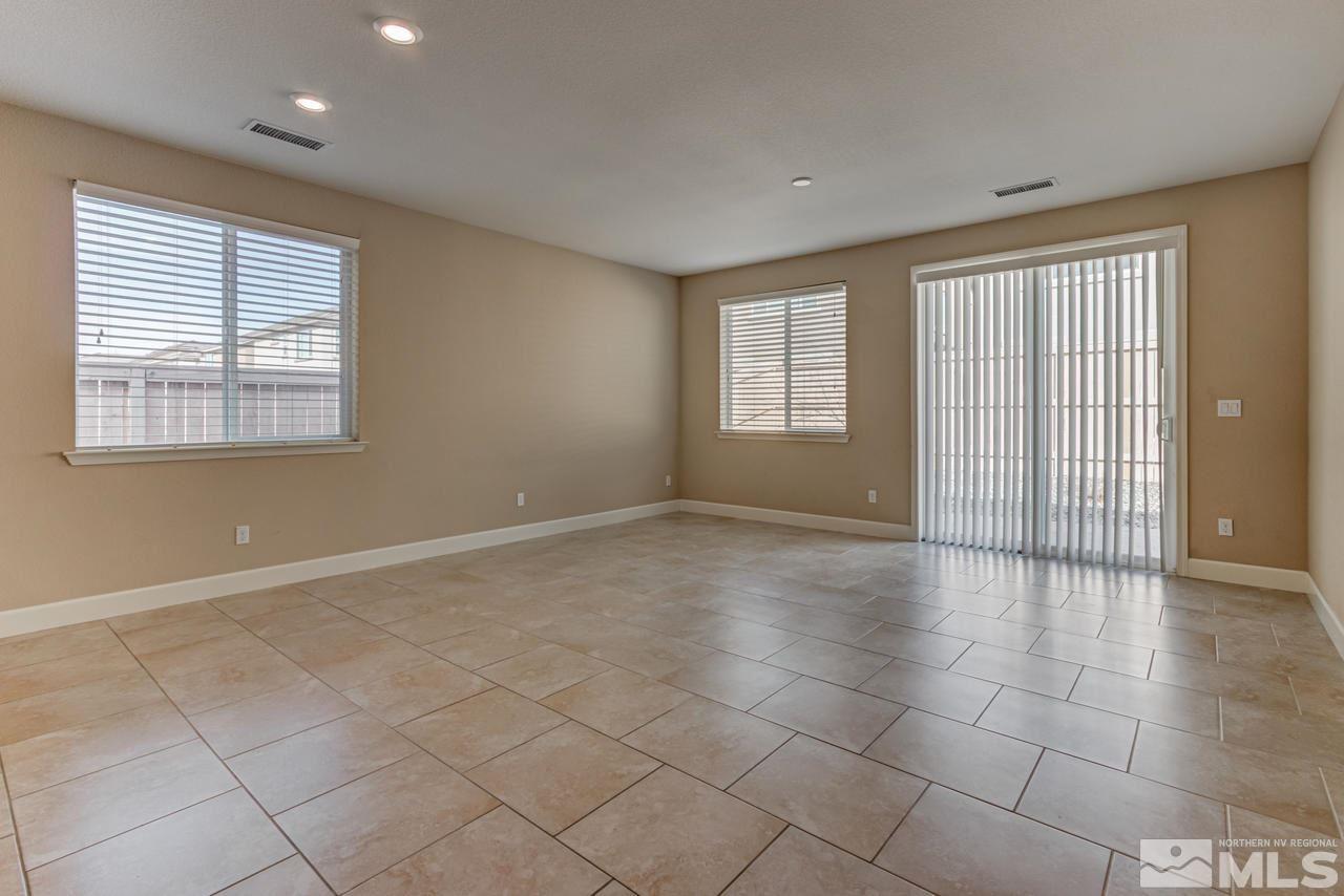 9728 Pachuca Drive Reno, NV 89521 - Photo 9 of 25 a view of an empty room with a window