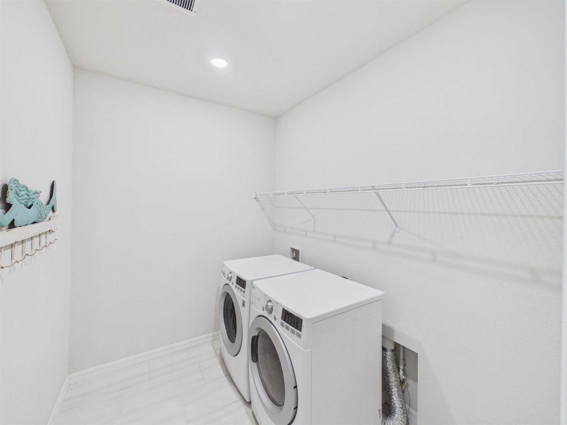 312 Salt Meadow Loop Yulee, FL 32097 - Photo 16 of 22 a utility room with dryer and washer