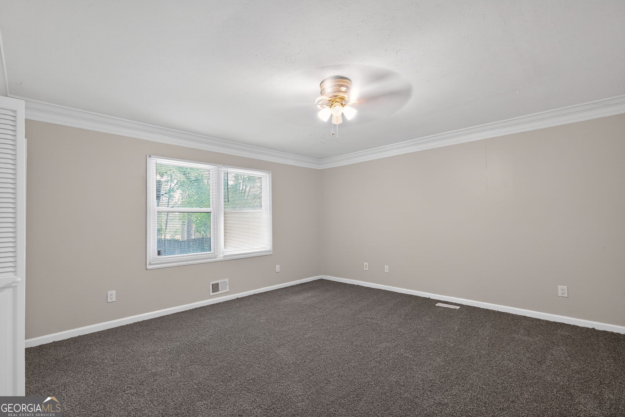 3285 Old Salem Road Southeast Conyers, GA 30013 - Photo 11 of 33 an empty room with a window