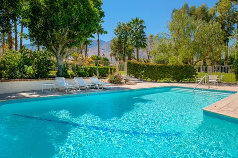 a view of a playground with green space