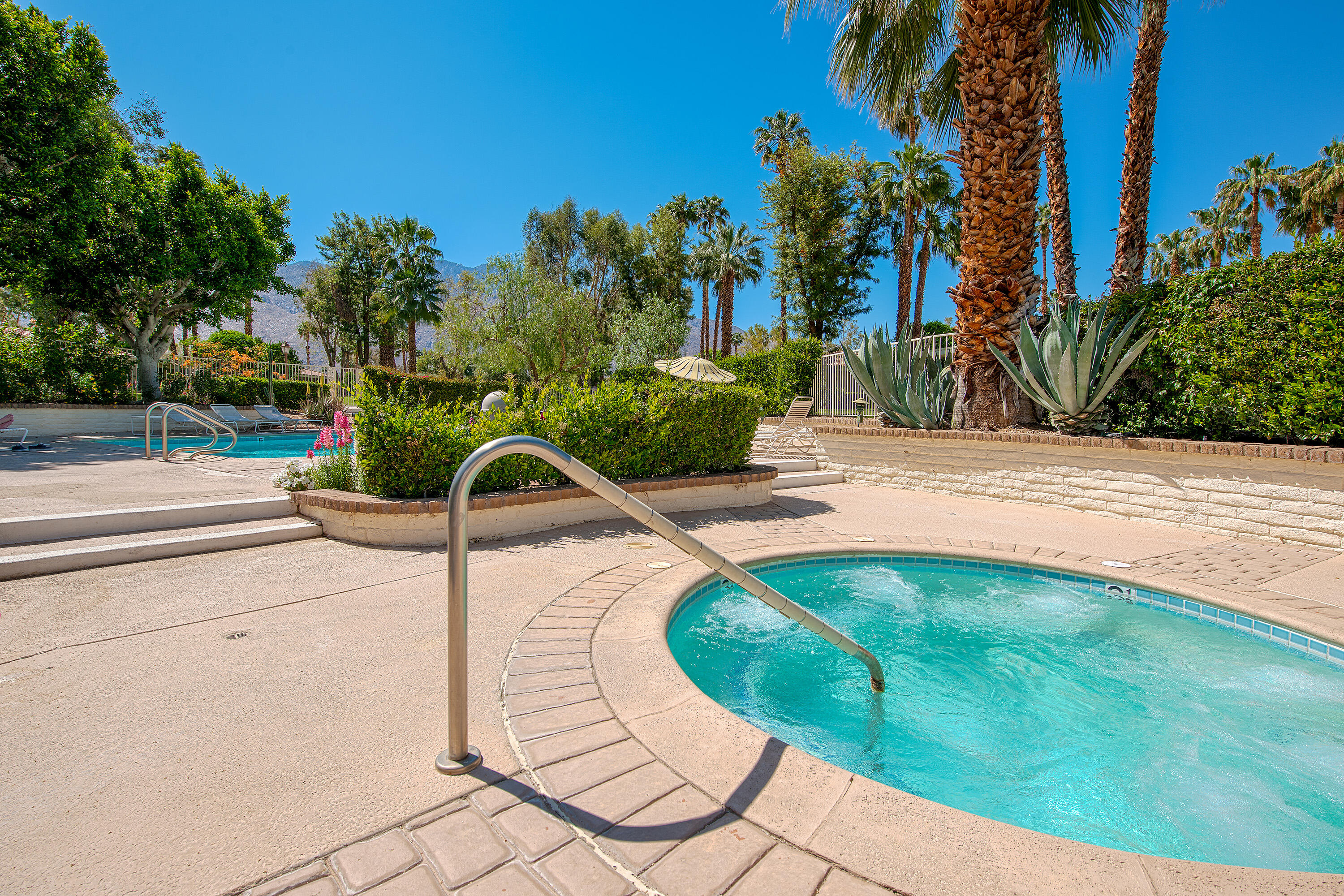 2264 Oakcrest Drive Palm Springs, CA 92264 - Photo 18 of 19 a view of a swimming pool with a yard