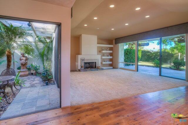 2264 Oakcrest Drive Palm Springs, CA 92264 - Photo 3 of 19 a living room with furniture and a fireplace
