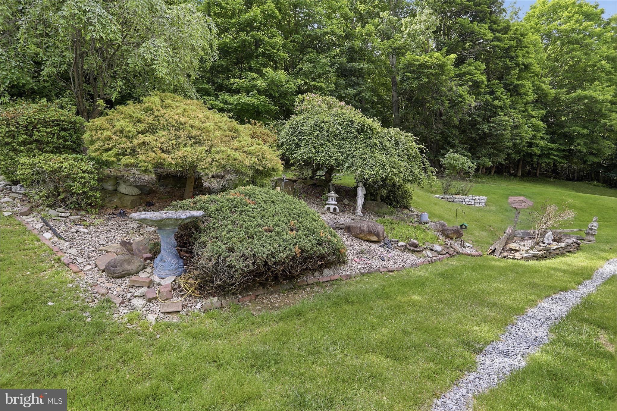 199 Buser Street Ridgeley, WV 26753 - Photo 36 of 49 a view of a garden with a fountain