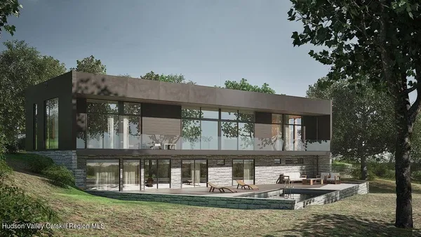 a house with river in front of it