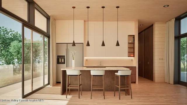 a view of dining room with furniture window and wooden floor
