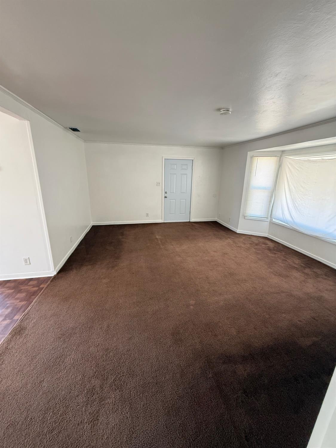 501 Rotan Avenue Madera, CA 93637 - Photo 4 of 23 an empty room with a window