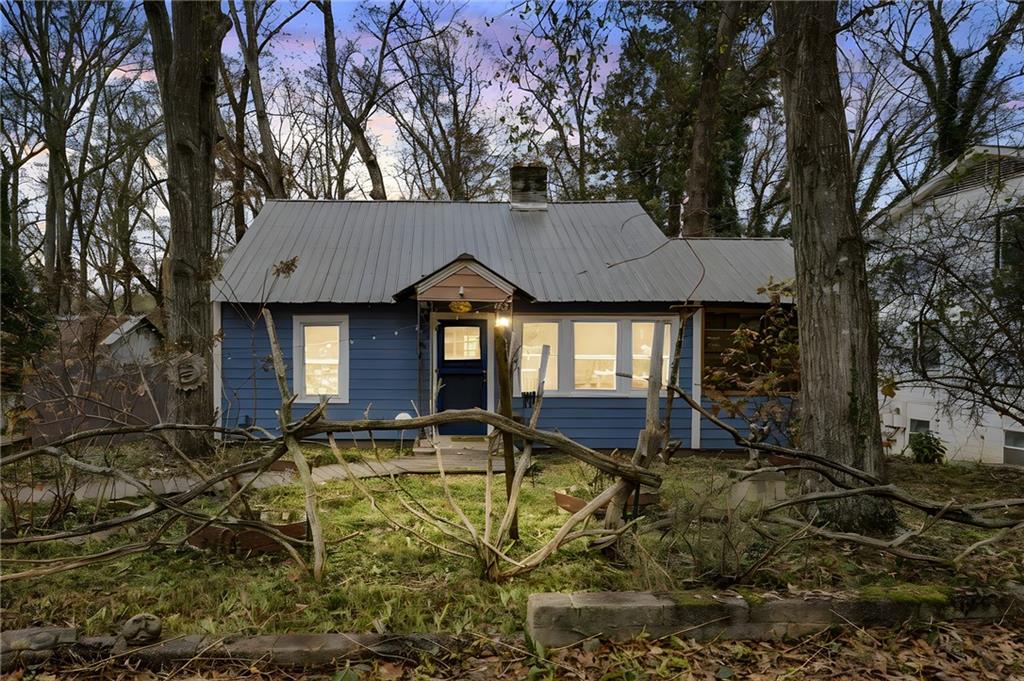 a backyard of house with yard and outdoor seating