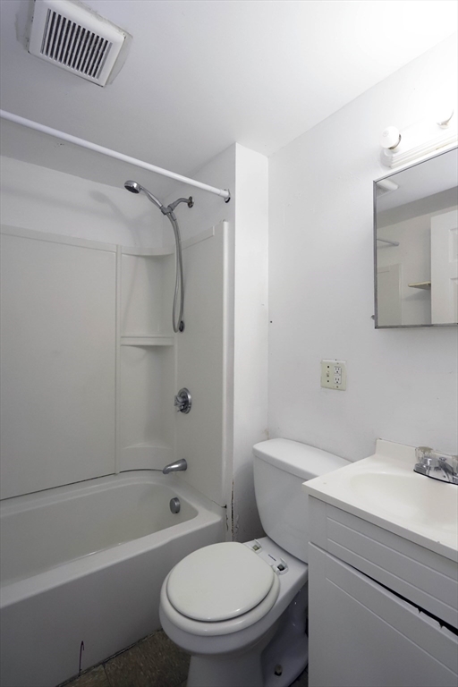 50-52 Rivet Street, Unit 2 New Bedford, MA 02744 - Photo 2 of 6 a bathroom with a toilet a sink and a bathtub