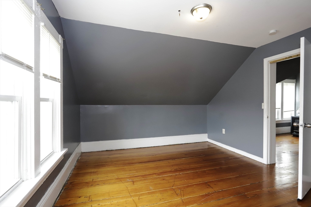 50-52 Rivet Street, Unit 2 New Bedford, MA 02744 - Photo 3 of 6 a view of empty room with wooden floor
