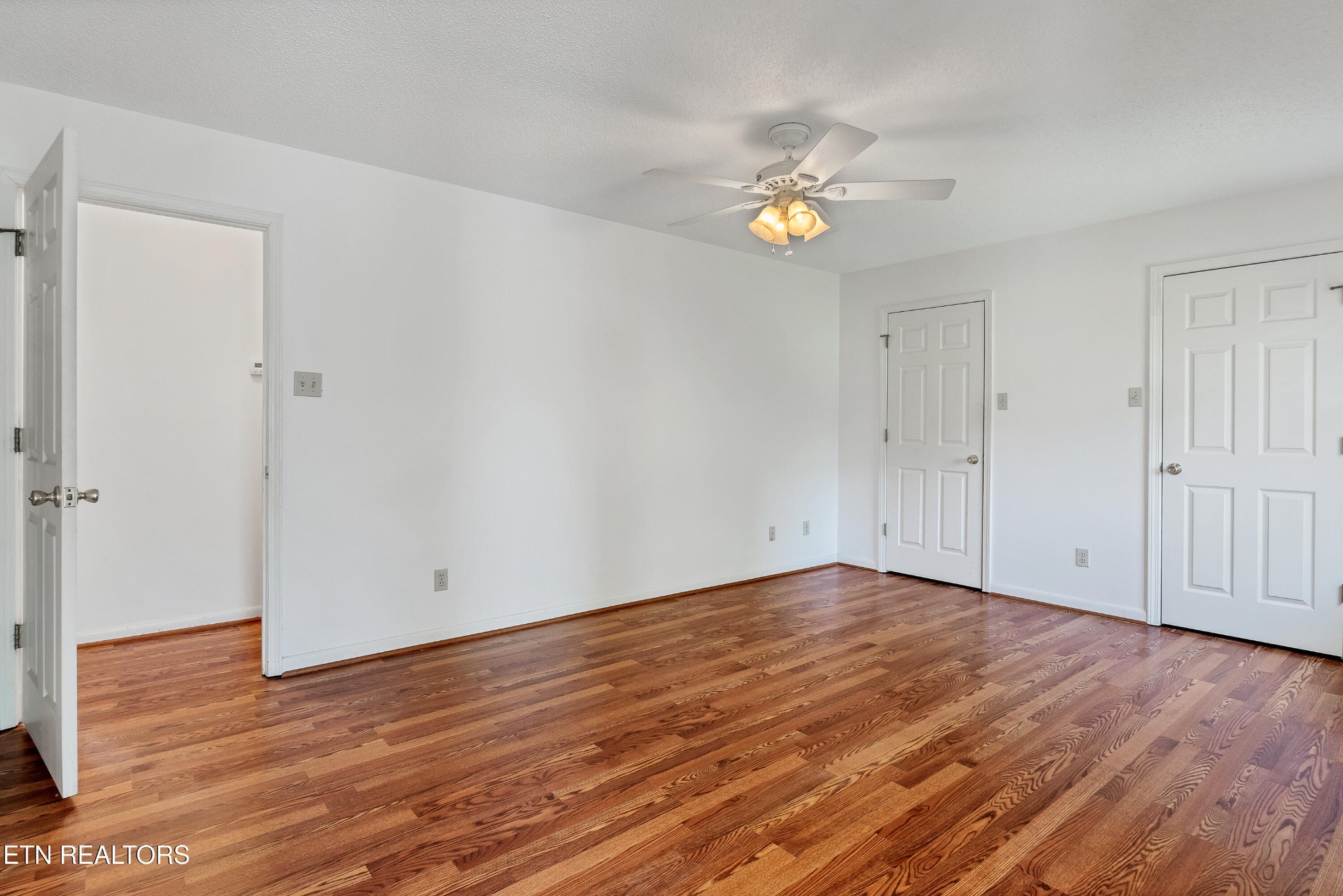 2036 Little Best Road Maryville, TN 37803 - Photo 31 of 54 a view of an empty room with wooden floor and white walls