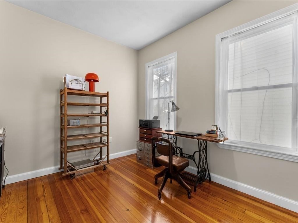 11 Doris Street, Unit 1 Boston, MA 02125 - Photo 14 of 17 a view of a workspace with furniture and a window