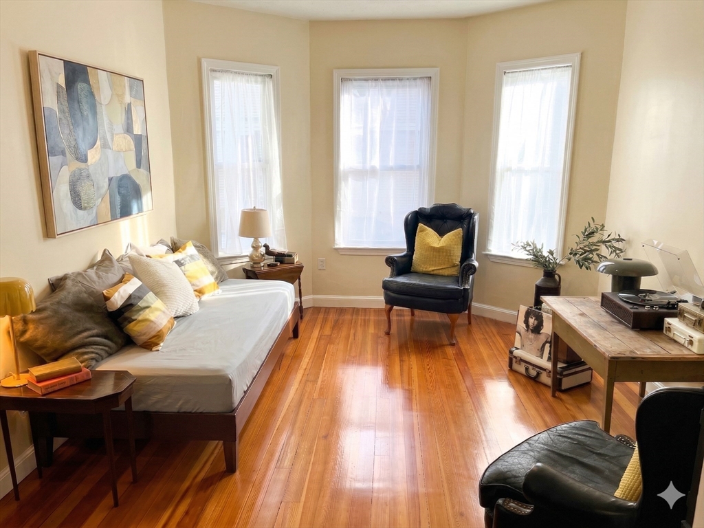 11 Doris Street, Unit 1 Boston, MA 02125 - Photo 5 of 17 a living room with furniture and wooden floor