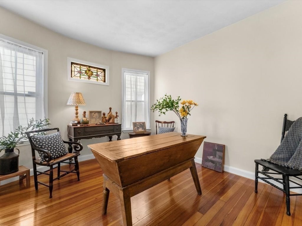 11 Doris Street, Unit 1 Boston, MA 02125 - Photo 7 of 17 a view of a dining room with furniture and wooden floor