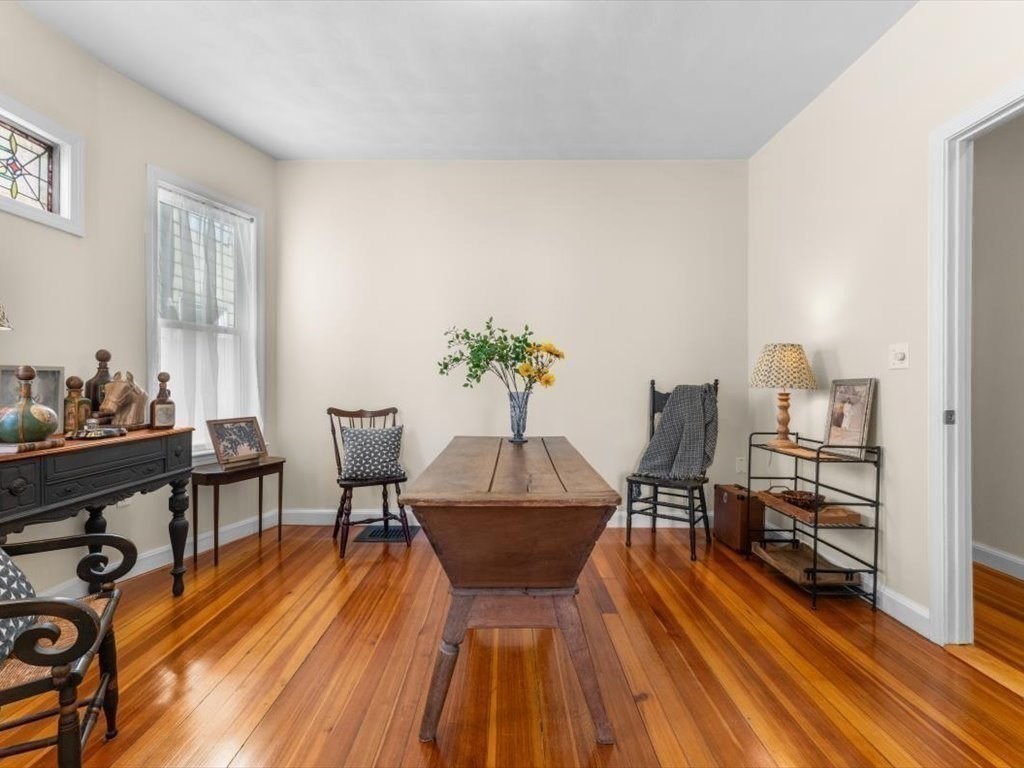 11 Doris Street, Unit 1 Boston, MA 02125 - Photo 9 of 17 a view of a dining room with furniture and wooden floor